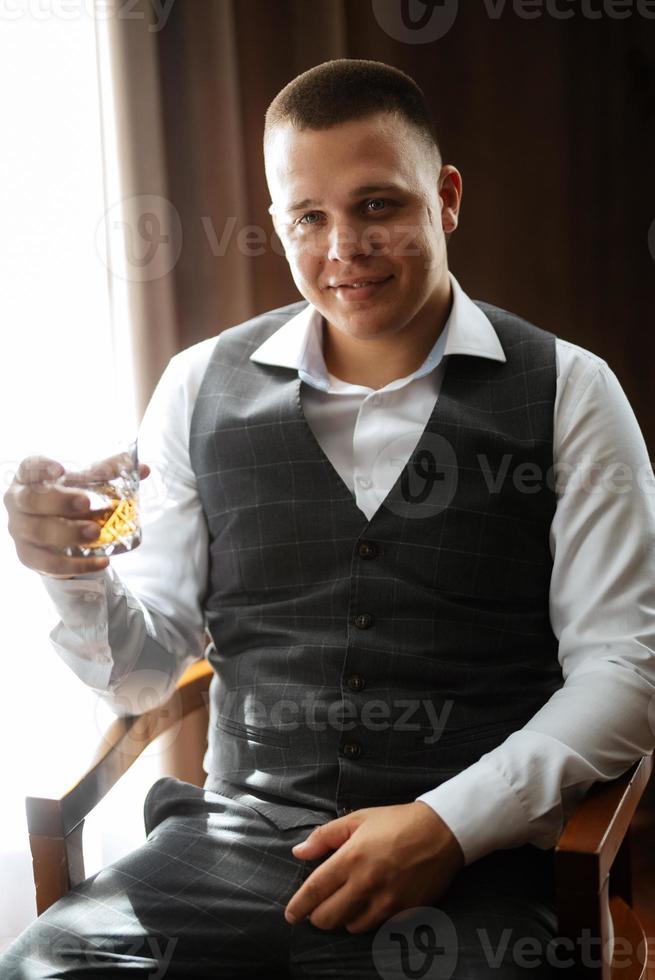 portrait of the groom of a man in the morning before the wedding photo