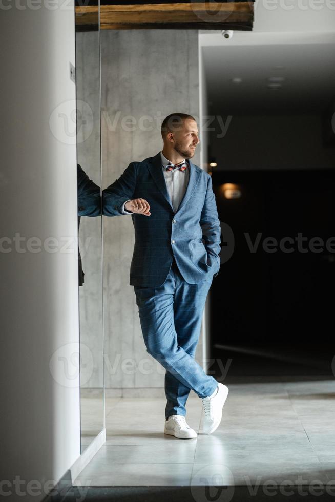 portrait of smiling groom with beard photo