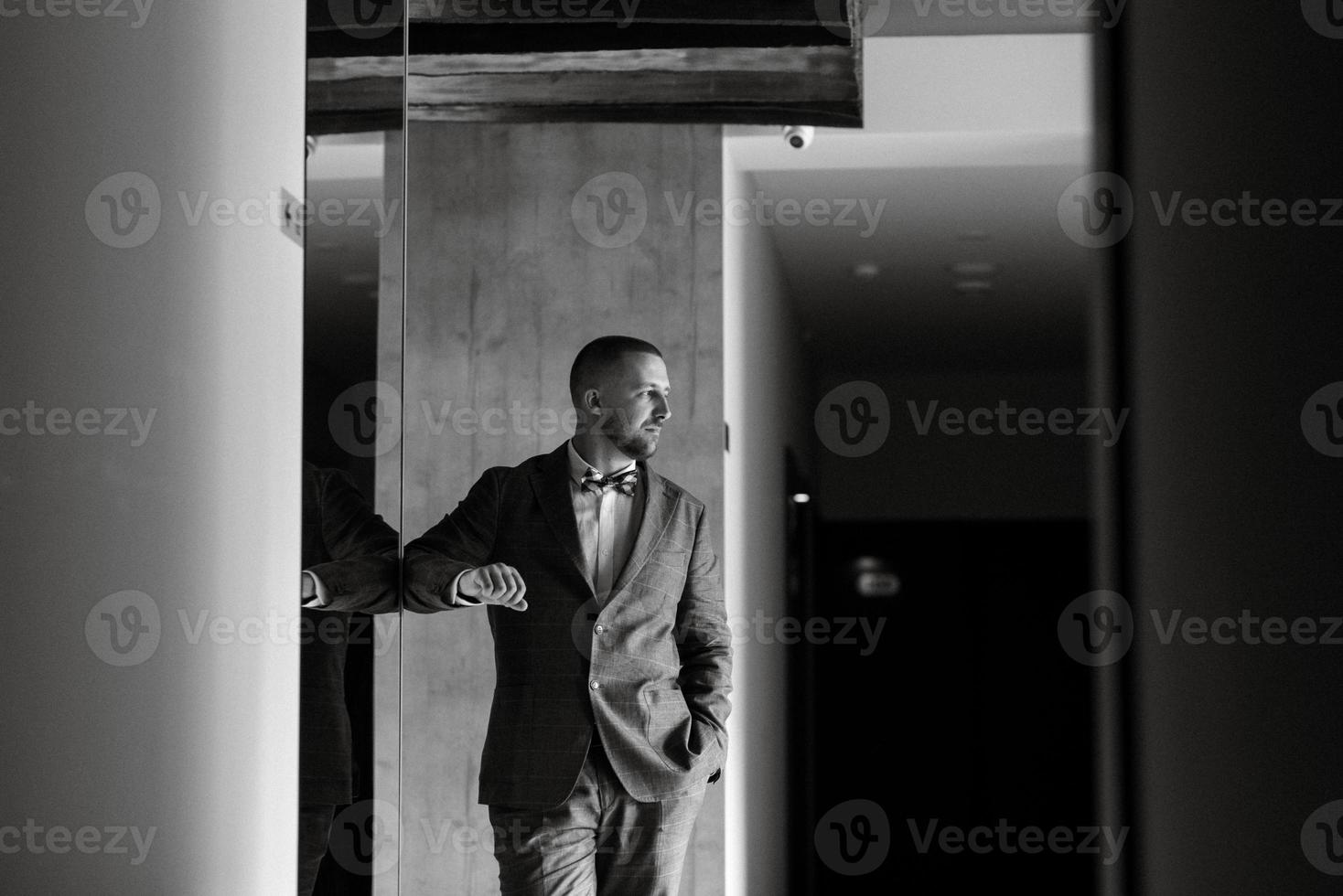 portrait of smiling groom with beard photo