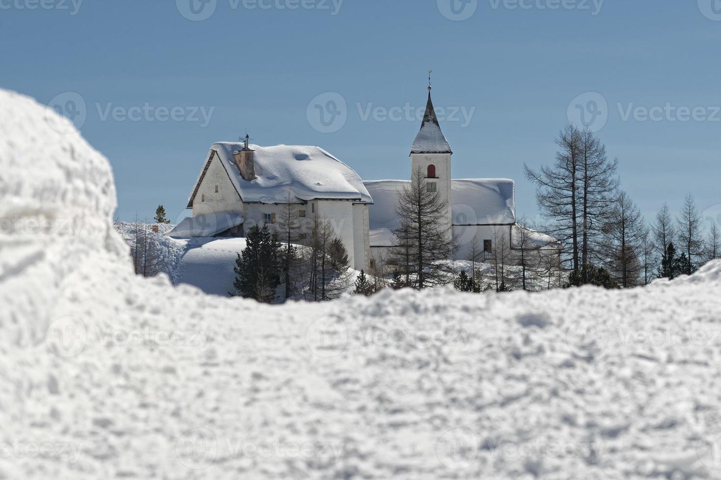 mountain church in winter photo