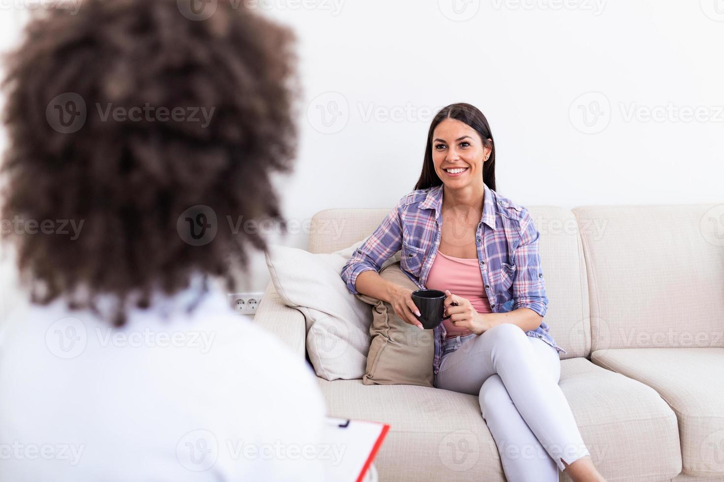 Psychologist listening to her patient and writing notes, mental health and counseling. Psychologist consulting and psychological therapy session concept photo