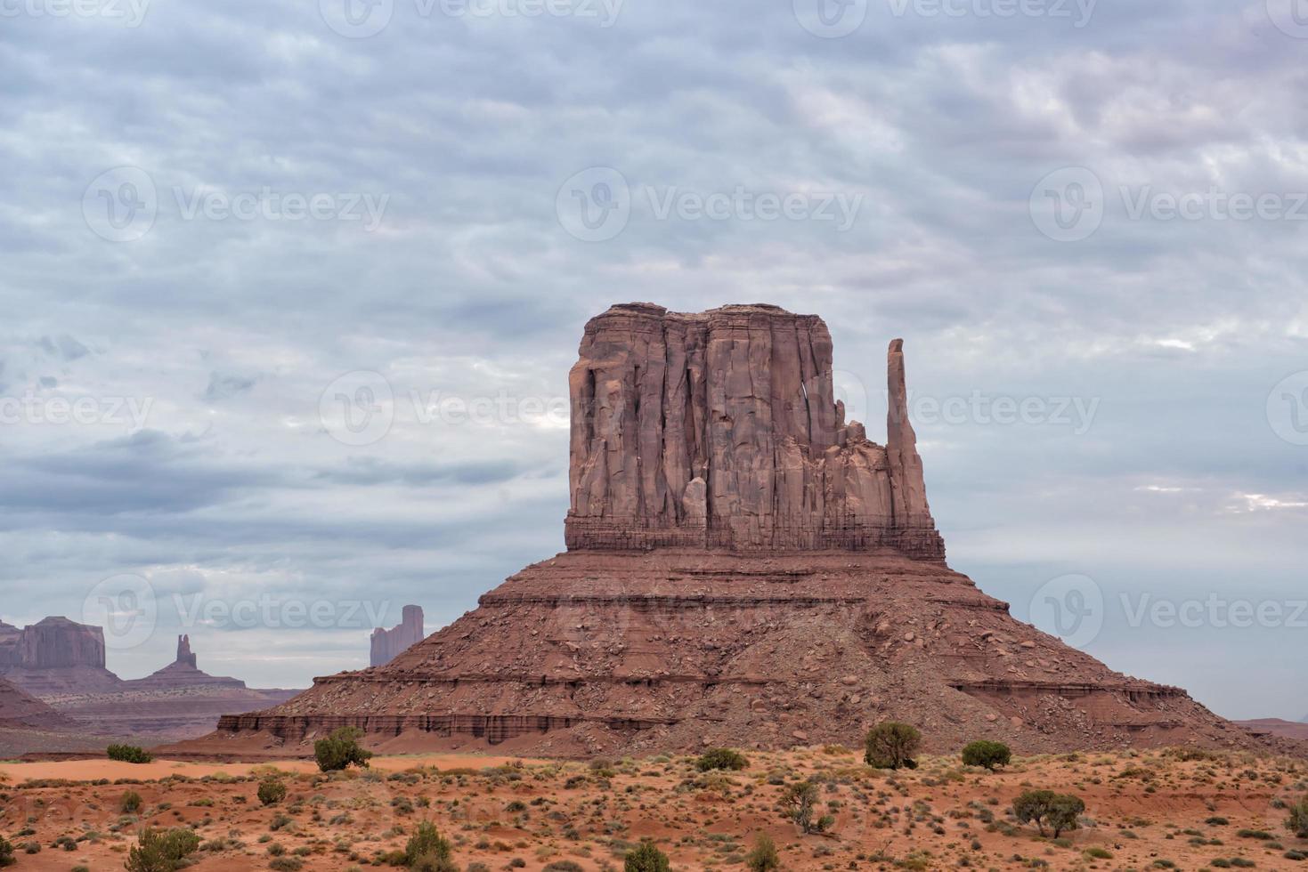 Monument Valley view on cloudy sky background photo