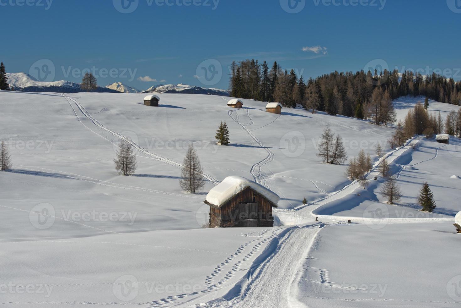 A wood cabin hut in the winter snow background photo