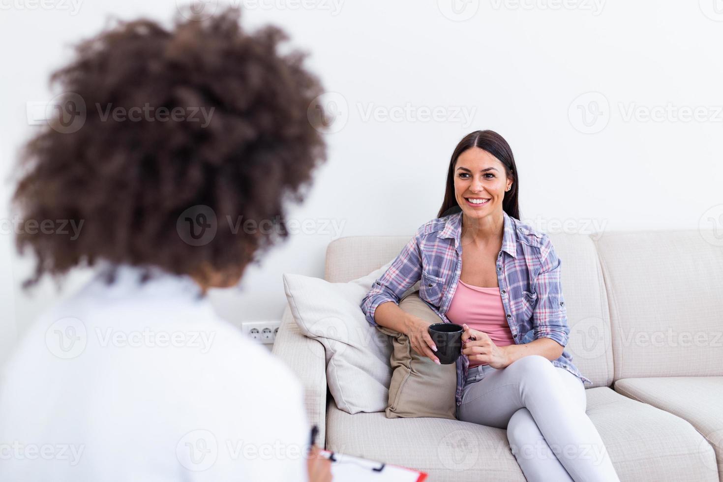 Psychologist listening to her patient and writing notes, mental health and counseling. Psychologist consulting and psychological therapy session concept photo
