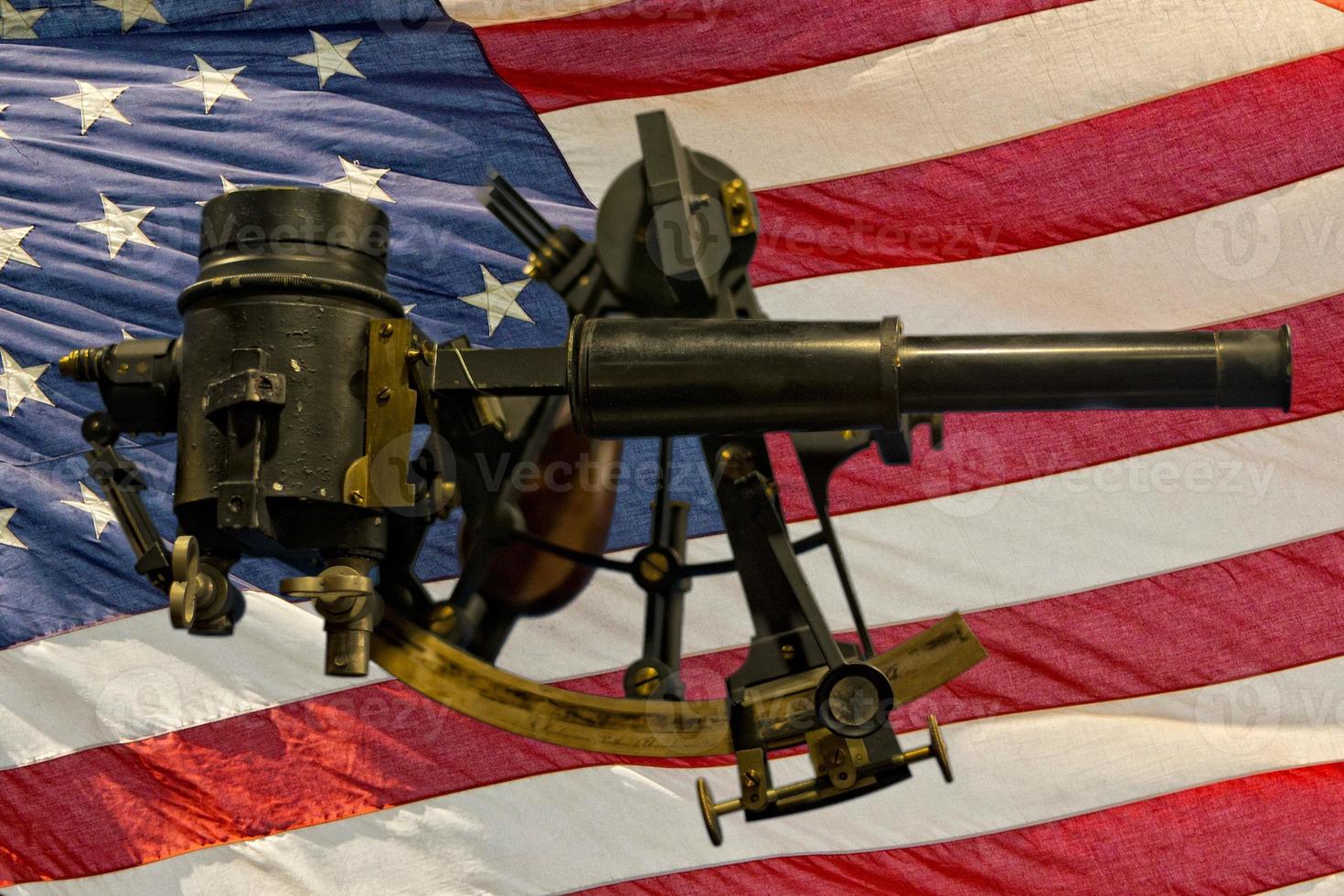 Old Antique Sextant on american flag background photo