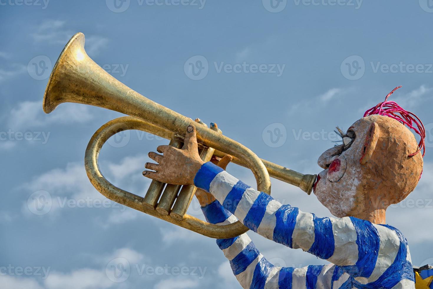 Stone-faced trumpet man photo