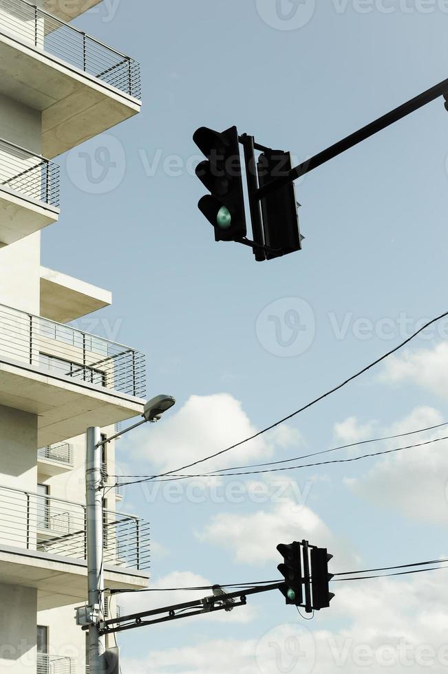 View of the street with traffic light and a modern building. photo