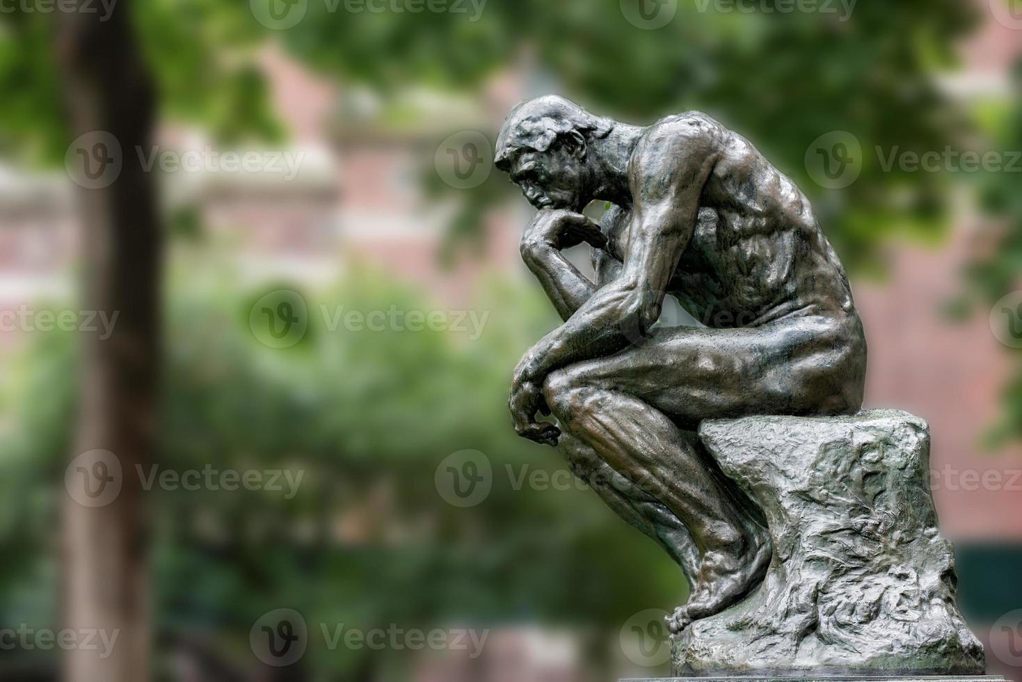 Thinker copper statue at university philosophy building photo