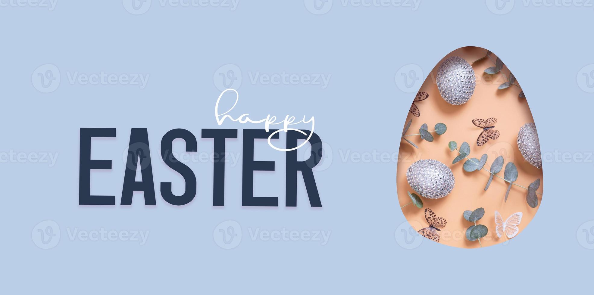 Happy Easter text and cut out Easter egg and colorful chocolate eggs in heart. Happy Easter greeting banner photo