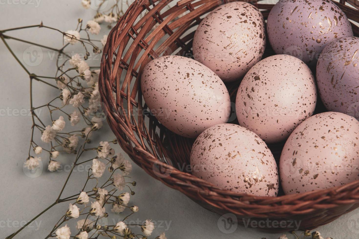 banner. Easter frame with eggs and feathers on a blue wooden background. Minimal concept. View from above. Card with copy space for text. photo