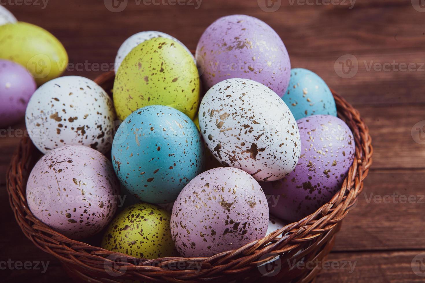 banner. Easter frame with eggs and feathers on a blue wooden background. Minimal concept. View from above. Card with copy space for text. photo