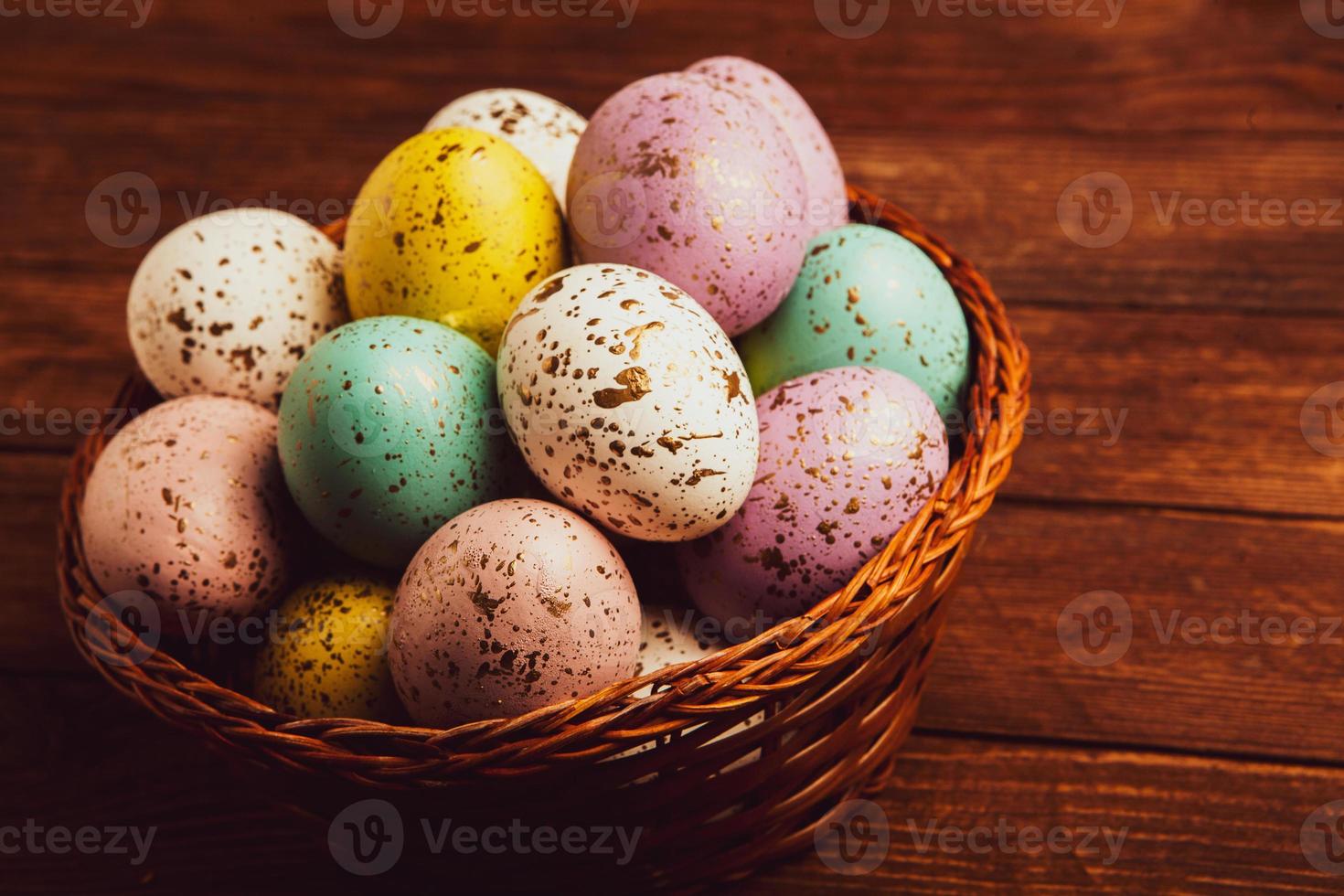 banner. Easter frame with eggs and feathers on a blue wooden background. Minimal concept. View from above. Card with copy space for text. photo