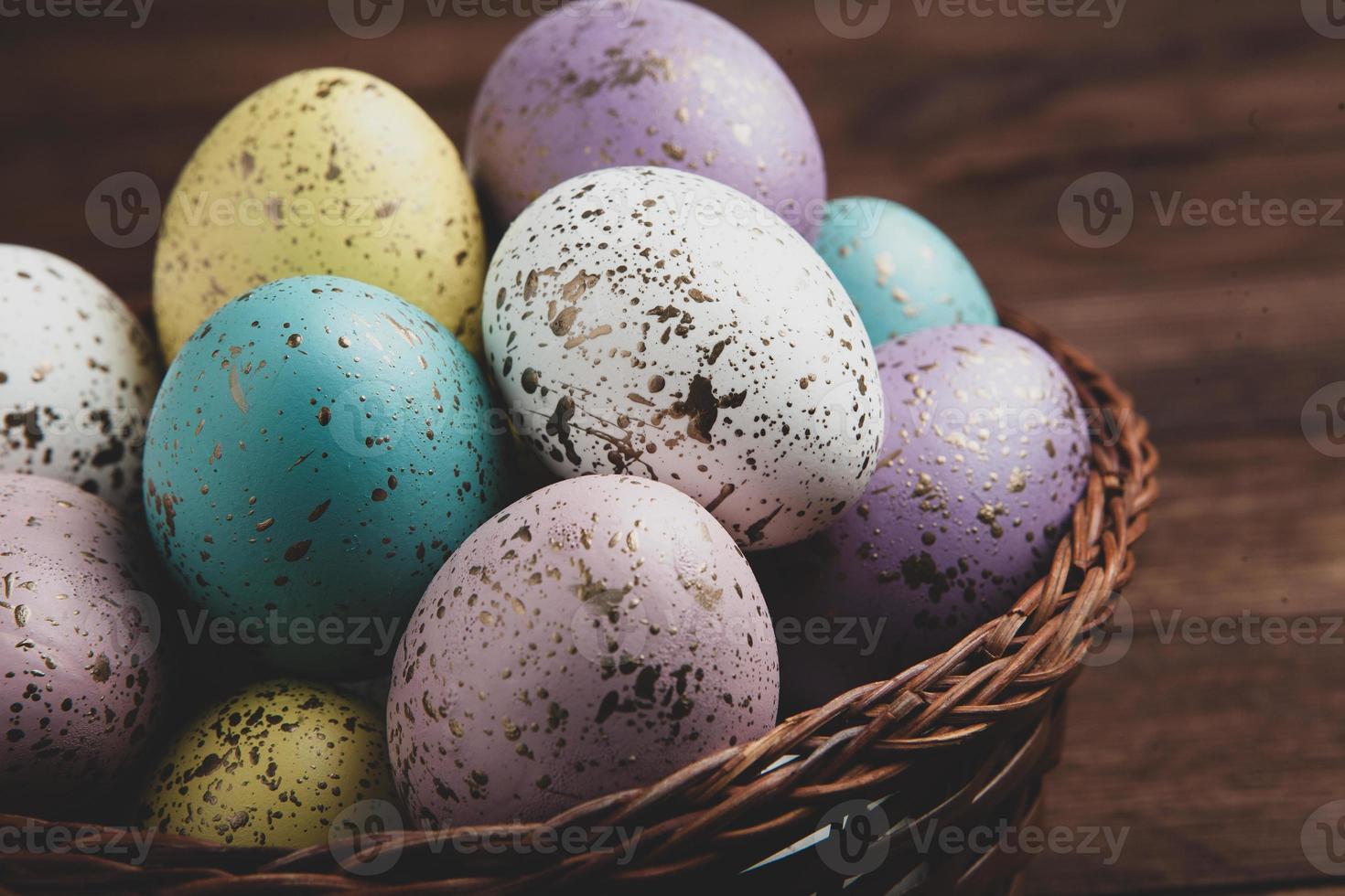 banner. Easter frame with eggs and feathers on a blue wooden background. Minimal concept. View from above. Card with copy space for text. photo