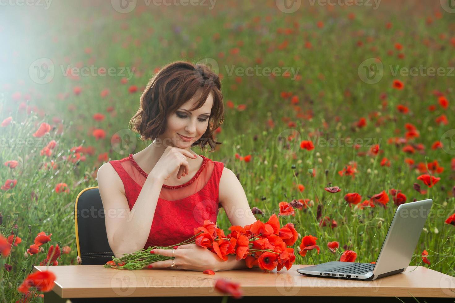 Beautiful woman or business woman talking on a cell phone outside. Outdoor portrait of a beautiful happy businesswoman talking on cell phone. photo