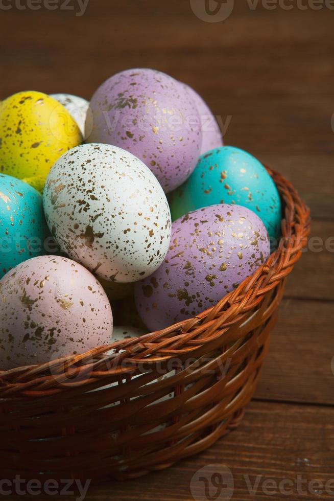 banner. Easter frame with eggs and feathers on a blue wooden background. Minimal concept. View from above. Card with copy space for text. photo