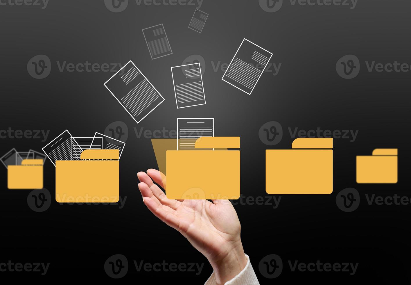 A female hand and virtual icons of folders and files, a concept of data organization and archiving, remote data management, paperless photo