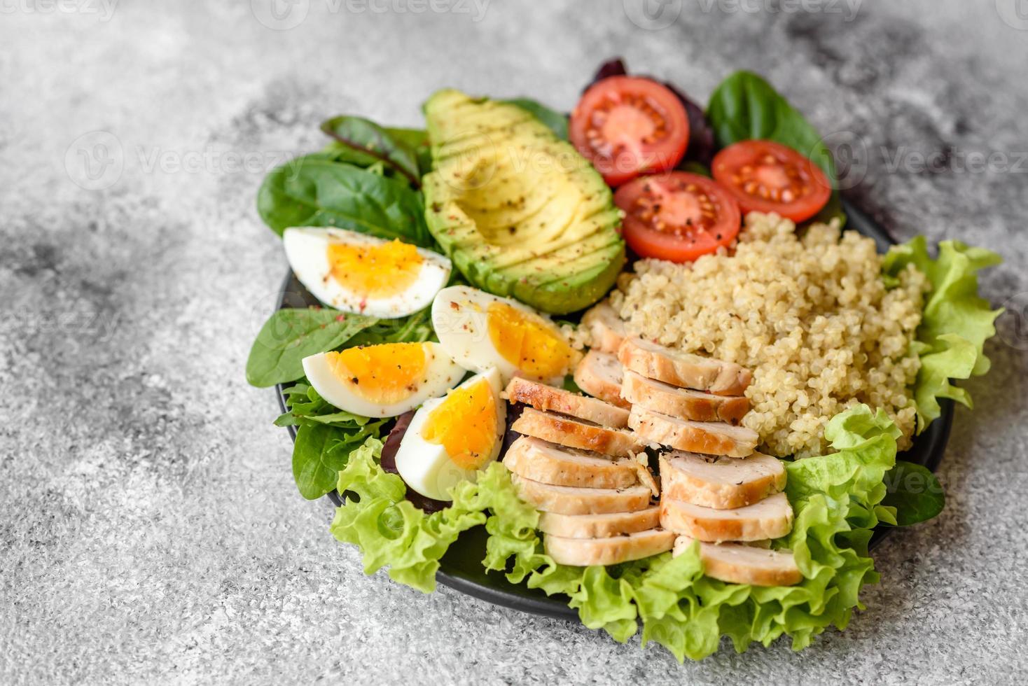 Delicious healthy lunch consisting of chicken, avocado, quinoa, eggs