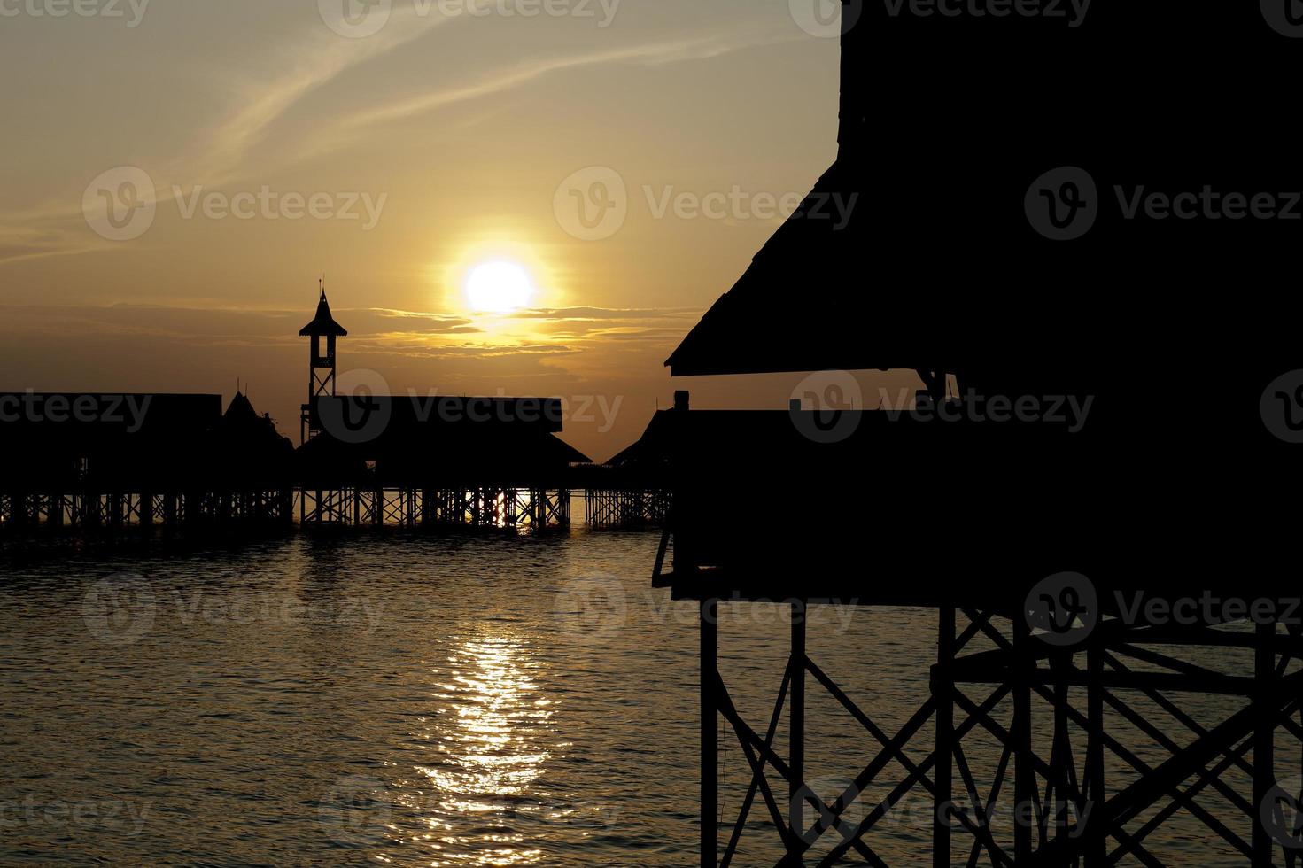 A  Stilt House at the sunset photo