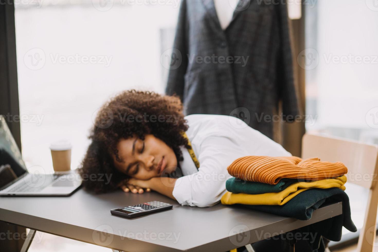 Startup SME small business entrepreneur of freelance Asian woman wearing apron using laptop and box to receive and review orders online to prepare to pack sell to customers, online sme business ideas. photo