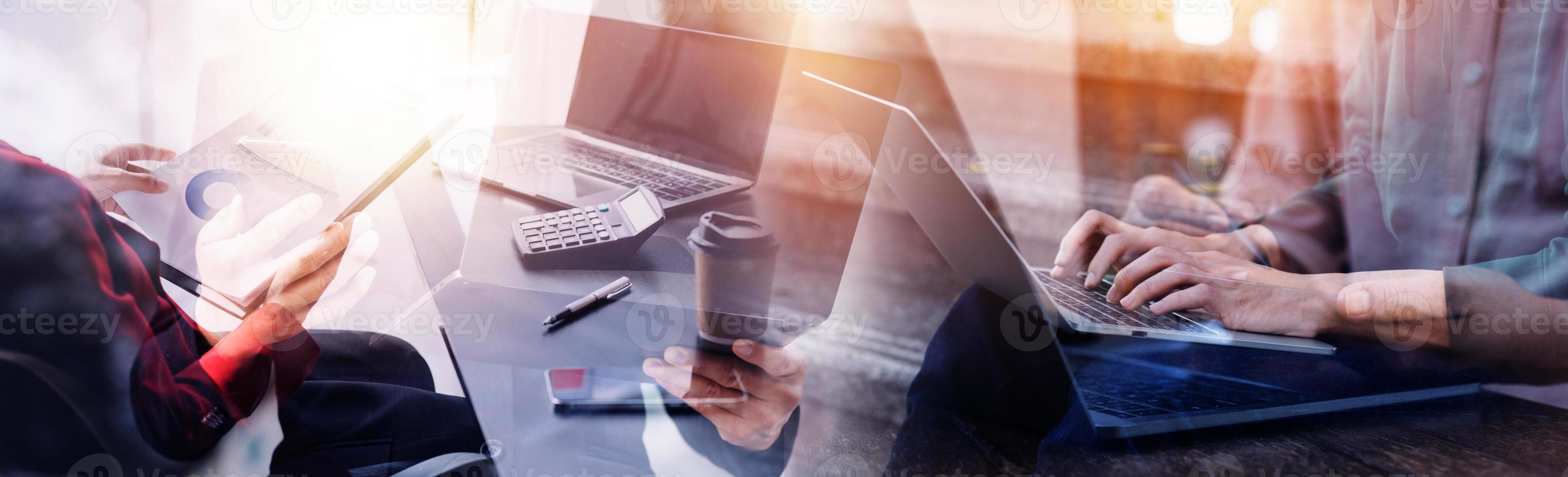 Financial analysts analyze business financial reports on a digital tablet planning investment project during a discussion at a meeting of corporate showing the results of their successful teamwork. photo