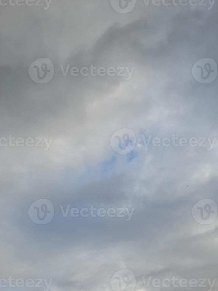 Beautiful white clouds on deep blue sky background. Large bright soft fluffy clouds are cover the entire blue sky. photo