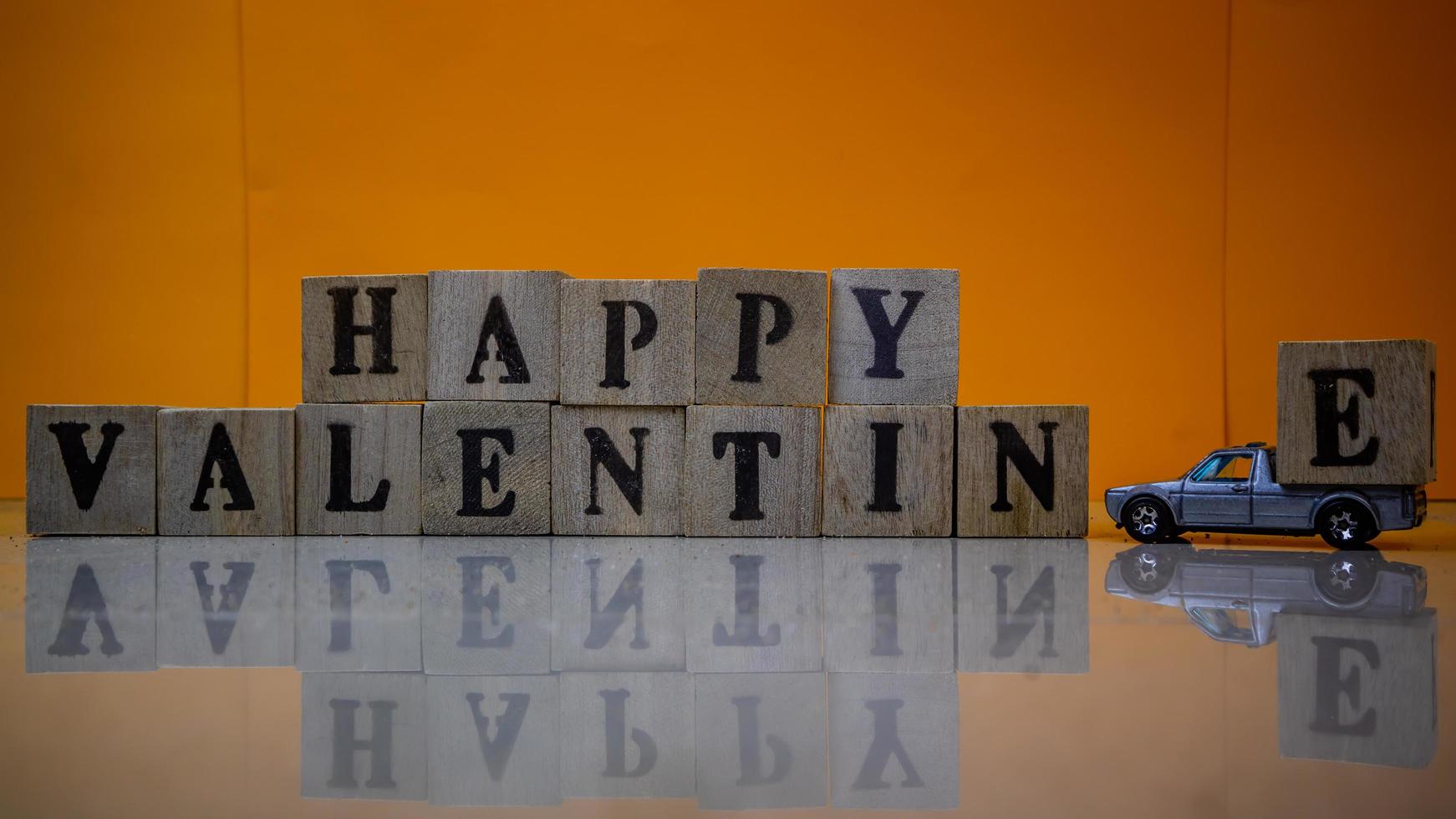 minahasa, Indonesia  January 2023, Happy valentine's day from stacked wooden blocks photo