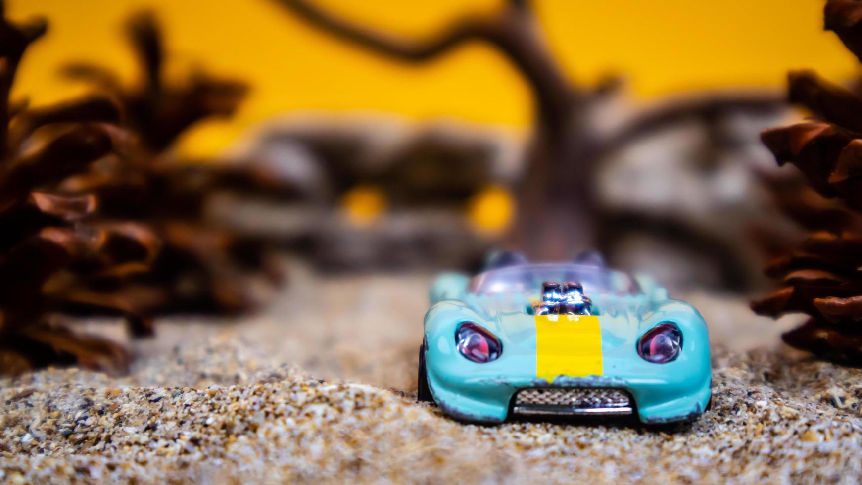 Minahasa, Indonesia  saturday, December 2022, a toy car among the pinecones photo