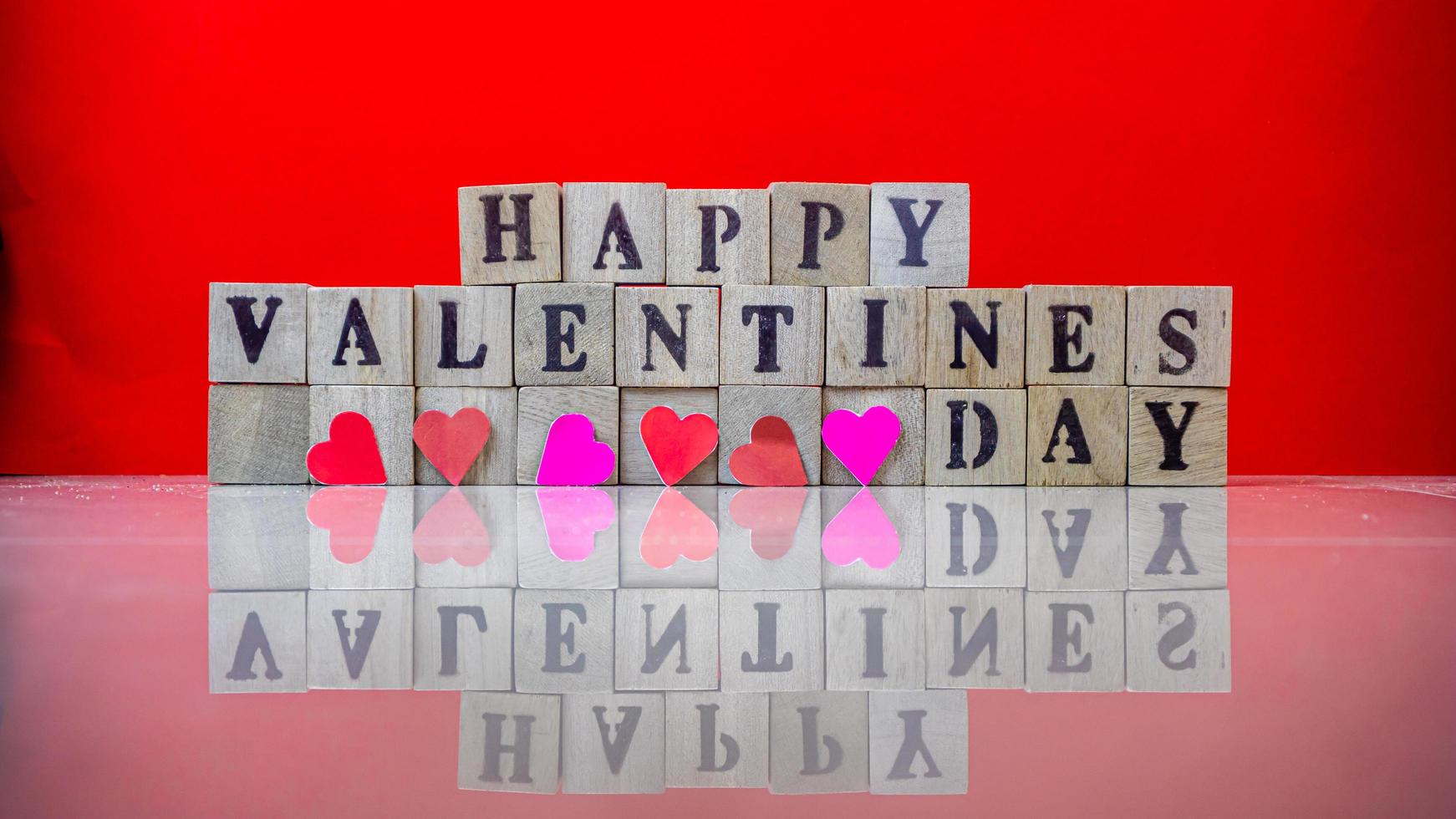 Happy valentine day on wooden blocks photo