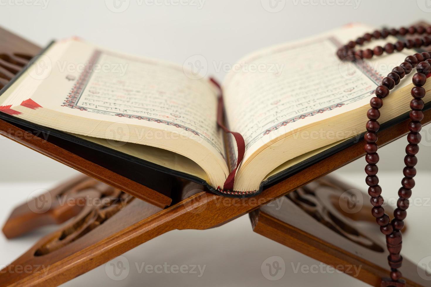 Open old Quran book on a table photo