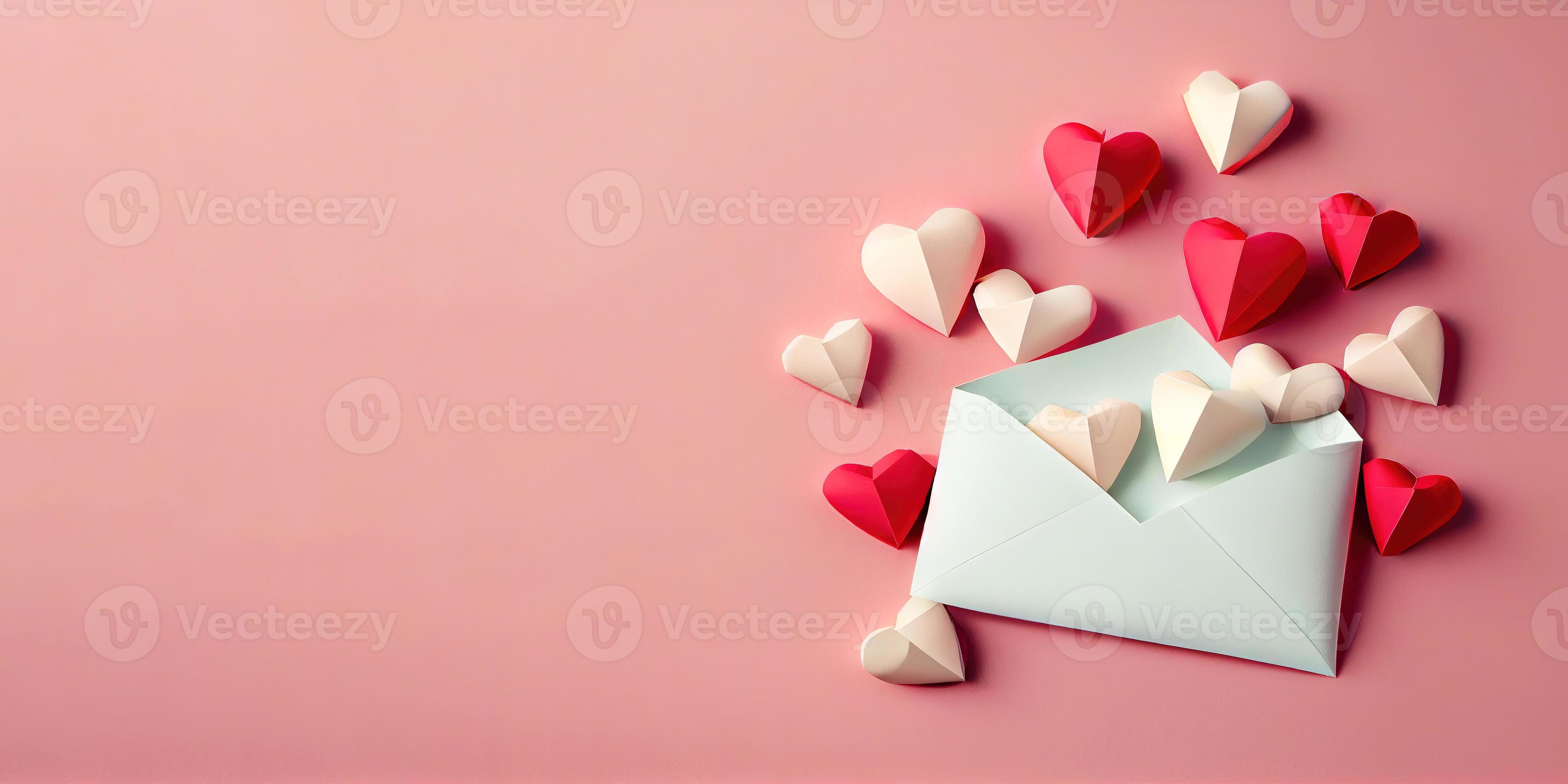 love letter envelope with paper craft hearts flat lay on pink