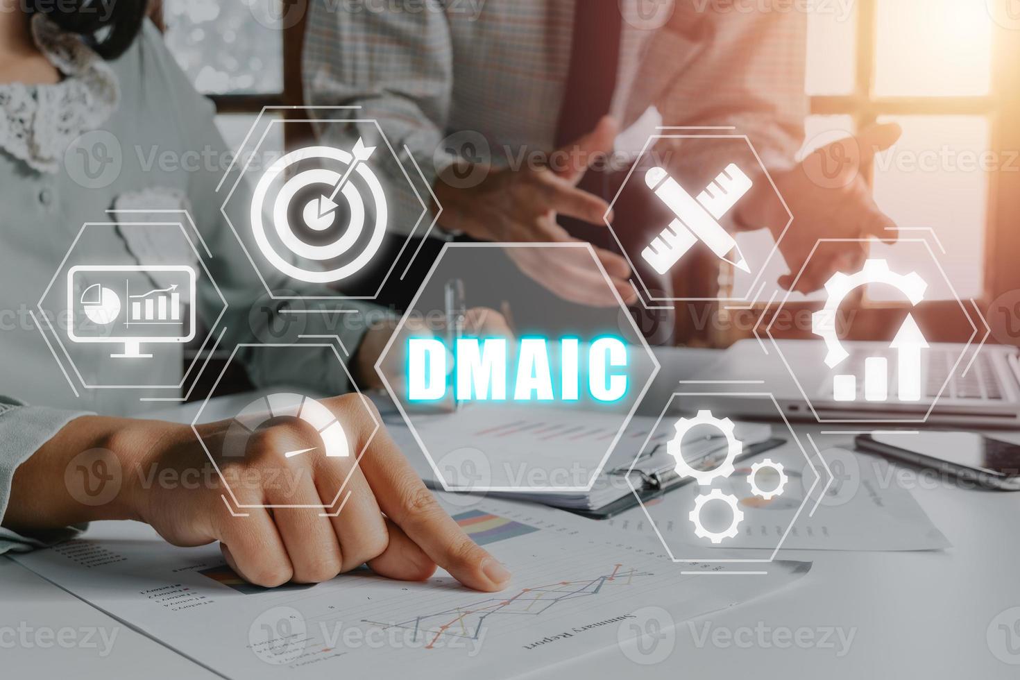 DMAIC is an acronym for Define, Measure, Analyze, Improve and Control concept, Business team analyzing financial data on office desk with DMAIC icon on virtual screen. photo