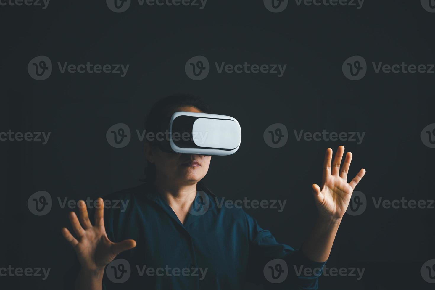 Woman with glasses of virtual reality. Future technology concept. Metaverse technology concept. VR virtual reality goggles. Futuristic lifestyle. female using virtual reality headset at home office. photo