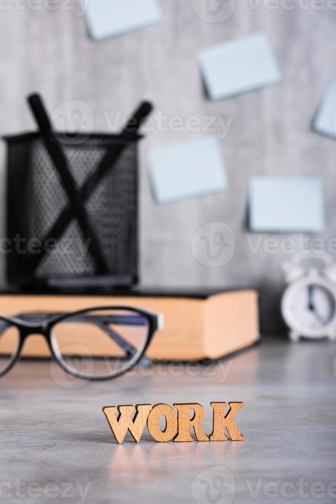 Work Concept. Word from wooden letters on the desktop. Burnout and mental health. Vertical view photo