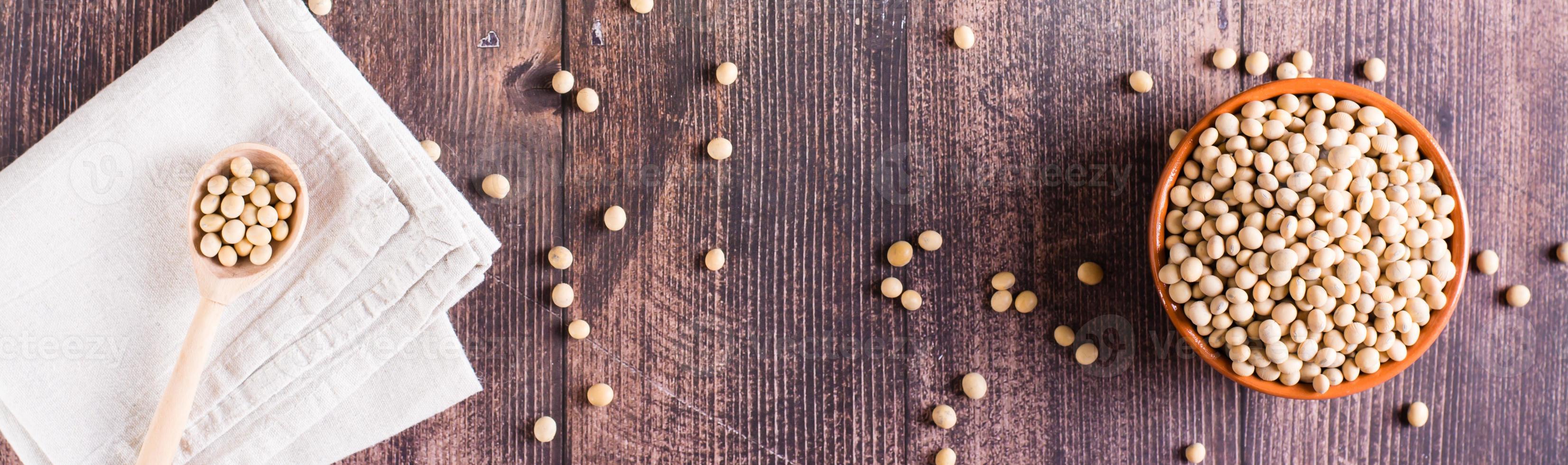 Ripe soybeans in a bowl and spoon. Vegetable protein and antioxidant. Top view. Web banner photo