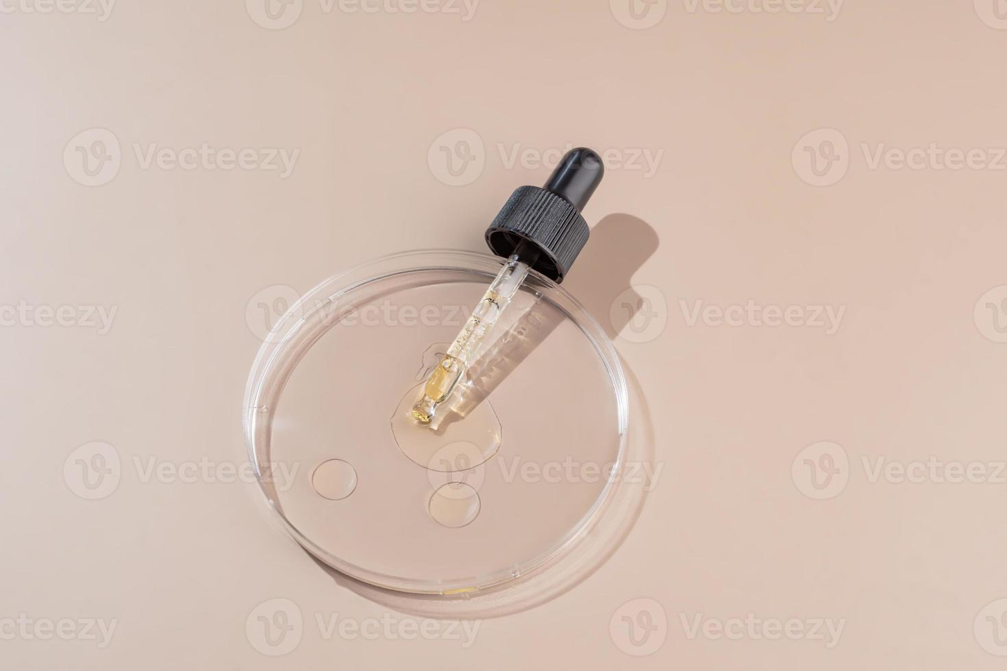 Glass petri dish with cosmetic products. Concept of the research and creating cosmetics, bio laboratory concept. Extracting herbs ingredients photo