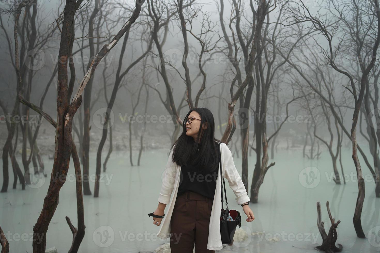 asian women traveller Standing in White Crater, Ciwidey, Bandung, West Java,Indonesia. photo