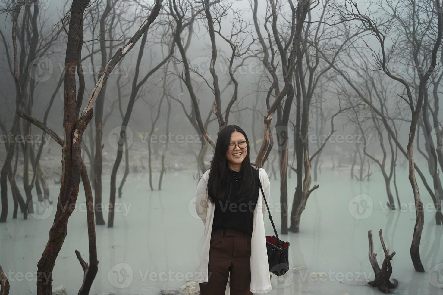 asian women traveller Standing in White Crater, Ciwidey, Bandung, West Java,Indonesia. photo