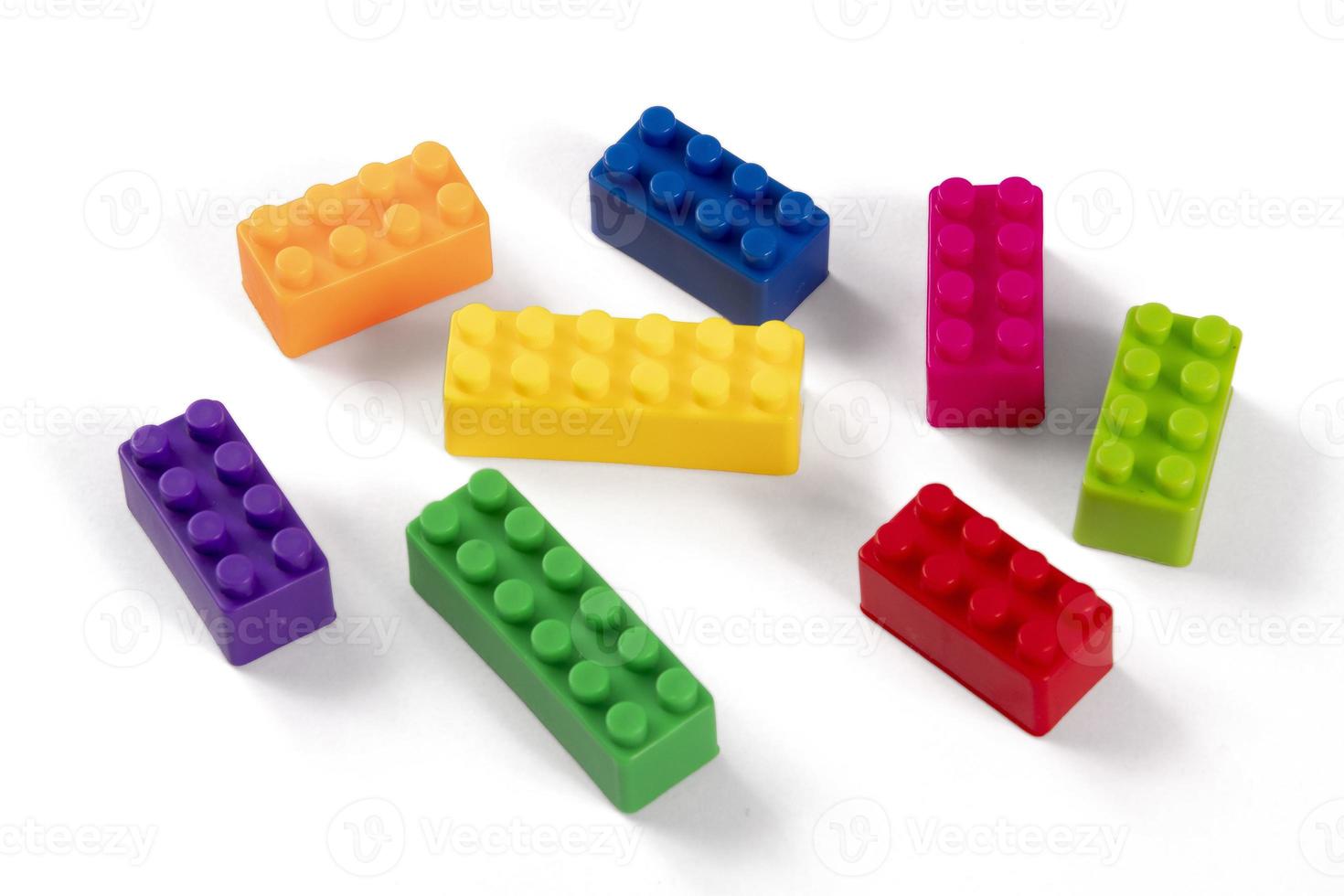 Colorful plastic building block patterns isolated. Toy for children photo