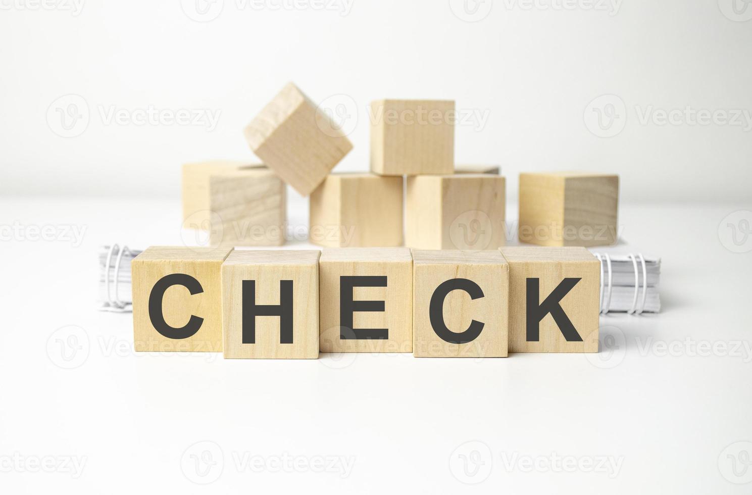 wooden cube block with CHECK business word on table background. Mission, Vision and core values concept photo