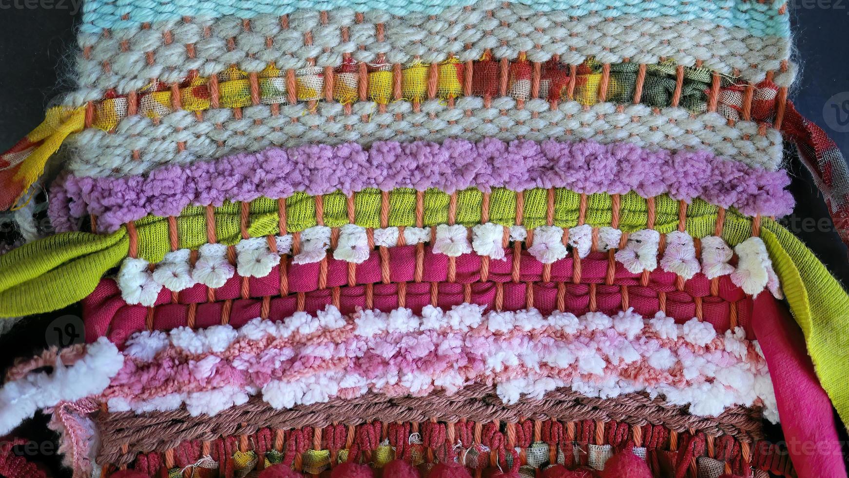Close up vivid colorful of hand woven fabric texture, linen, cotton. Fabric texture, woven rope texture pattern. Knitted fabric background, style rug surface, abstract design photo