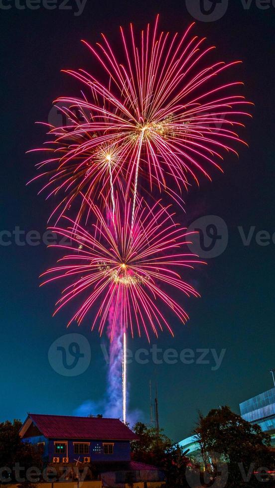 fireworks over the temple in the dark sky photo