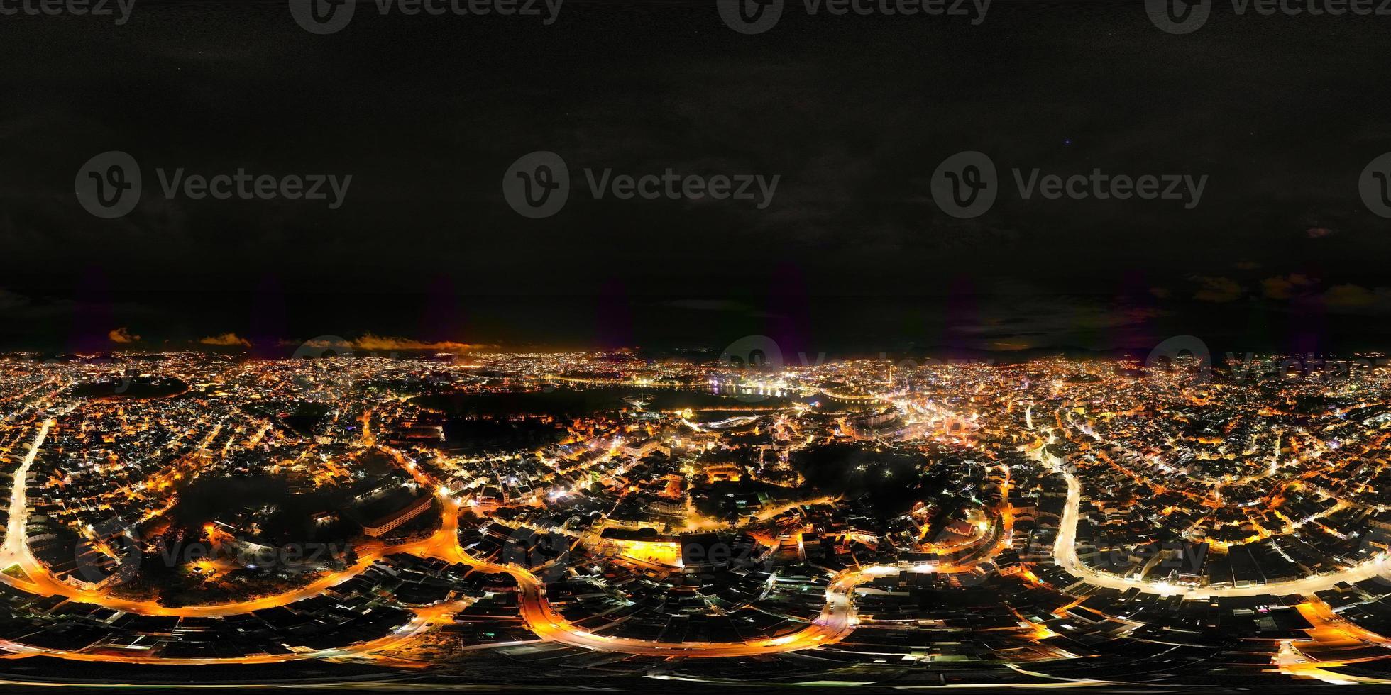 360 Panorama of Glowing Nighttime Cityscape in Da Lat City, Vietnam A Captivating View of Illuminated Streets and Skyscrapers under the Starry Night Sky photo