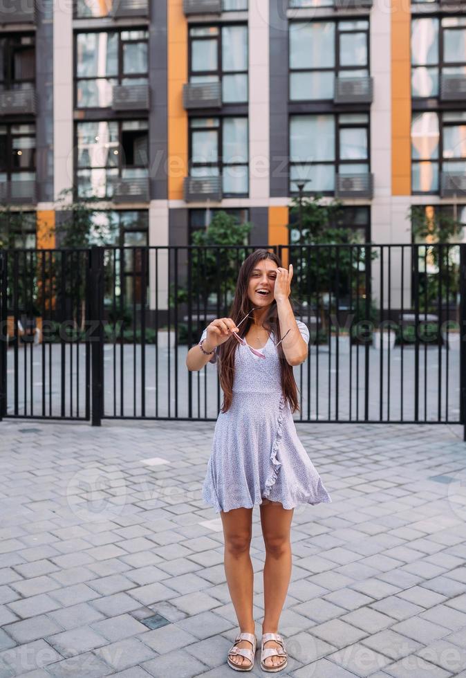 Woman on the background of large building photo