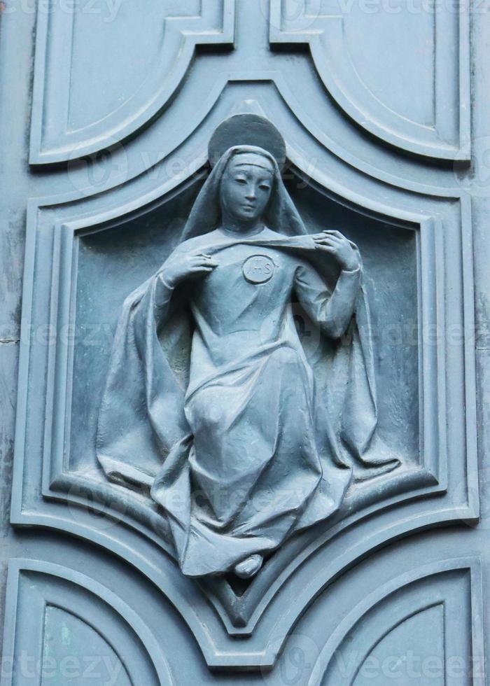 Close up fragment of medieval metal doors with decorative elements. Part of antique old door photo