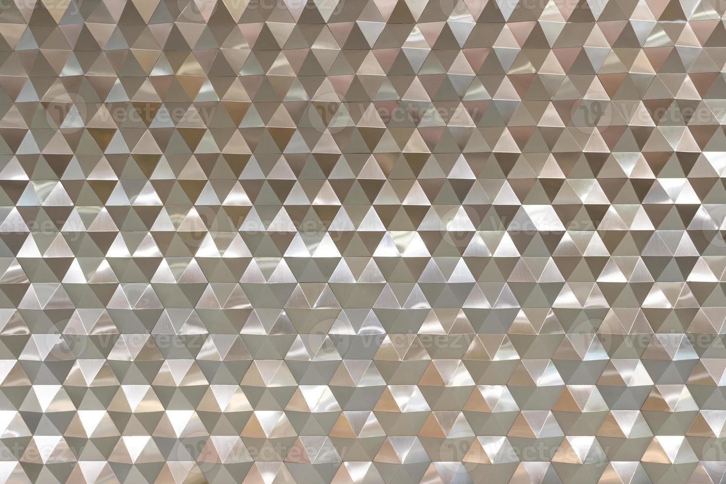 Abstract retro pattern of geometric shapes. Gold gradient mosaic backdrop. Geometric hipster triangular background. photo