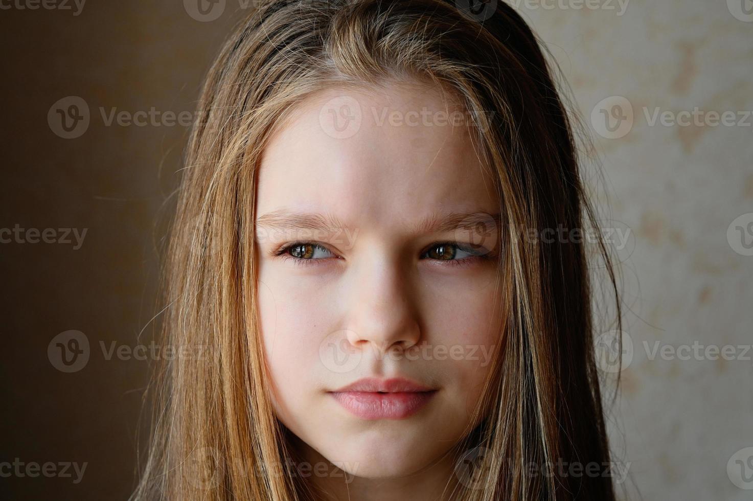 The girl looks into the distance. A romantic image. Portrait of a beautiful woman with long hair looking into the distance. photo