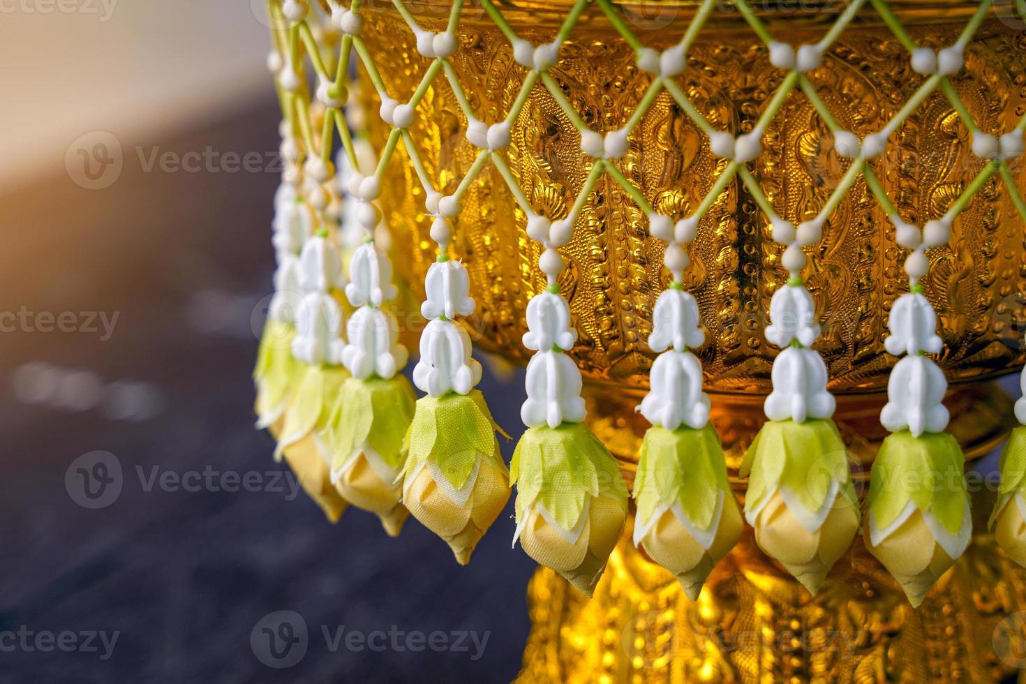 Uba is a flower that is strung in a string and attached to a bunch like a tassel for hanging on a tray with a pedestal or a flower garland. Soft and selective focus. photo