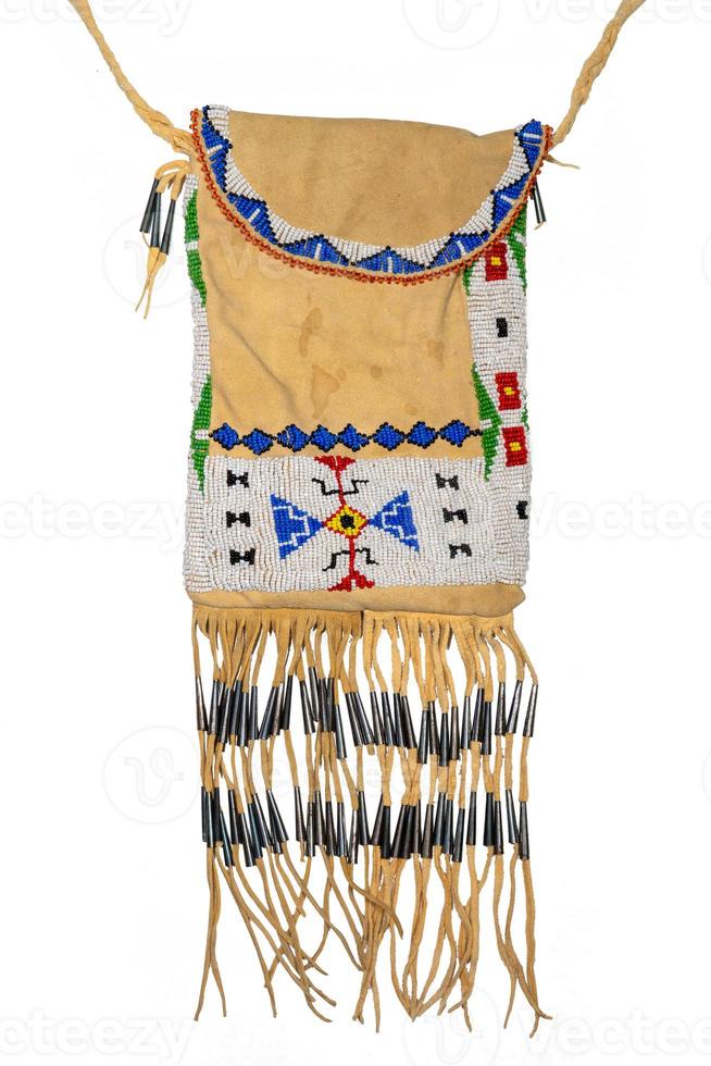 Bag of the North American Indians. Made from deerskin embroidered with colorful glass beads and leather cords photo