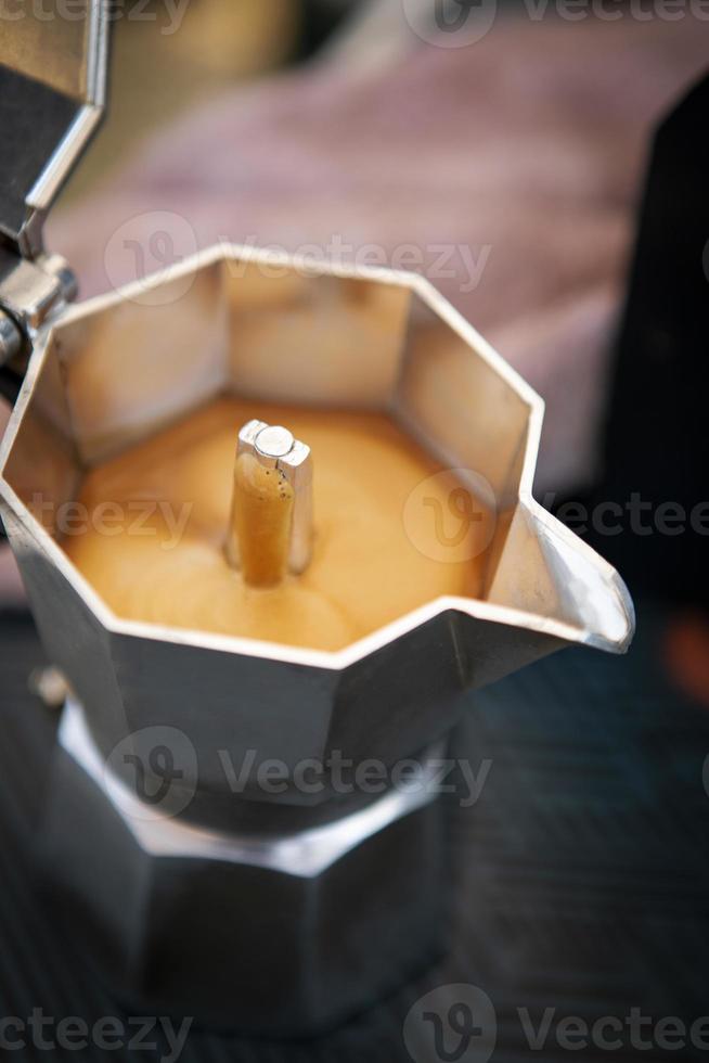 close up coffee creama in espresso boild pot photo