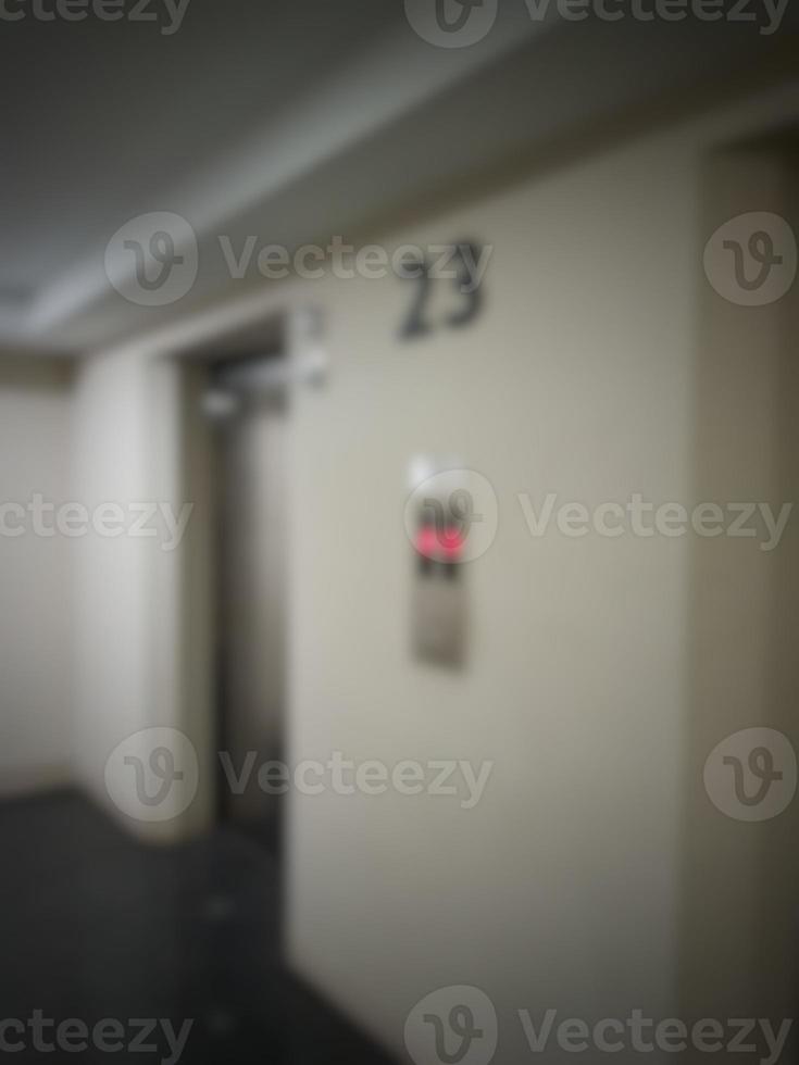 Defocused blurred photo of elevator corridor on floor 23 in a high rise building.